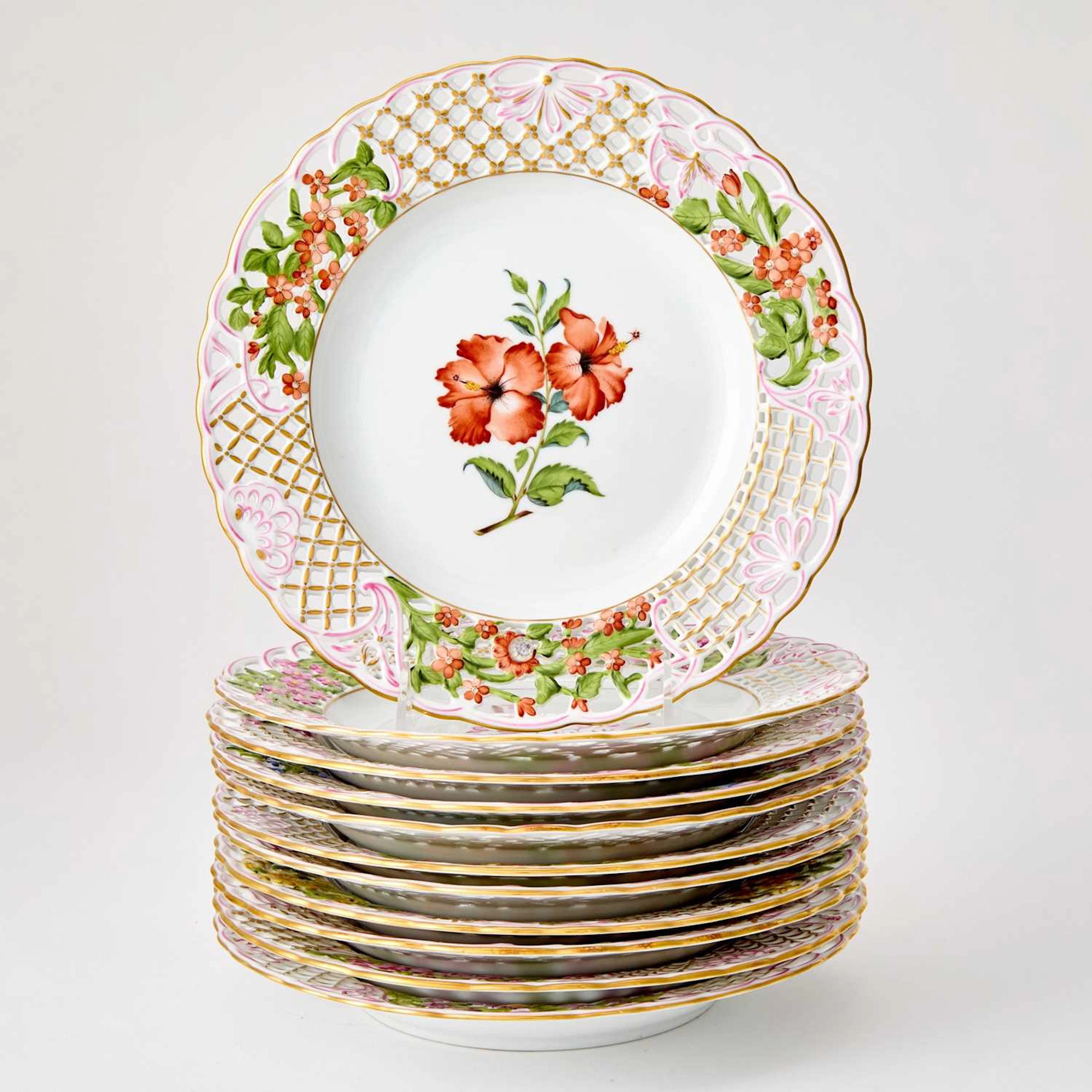 Set of Eleven Herend Gilt and Hand-Painted Pierced Porcelain Plates