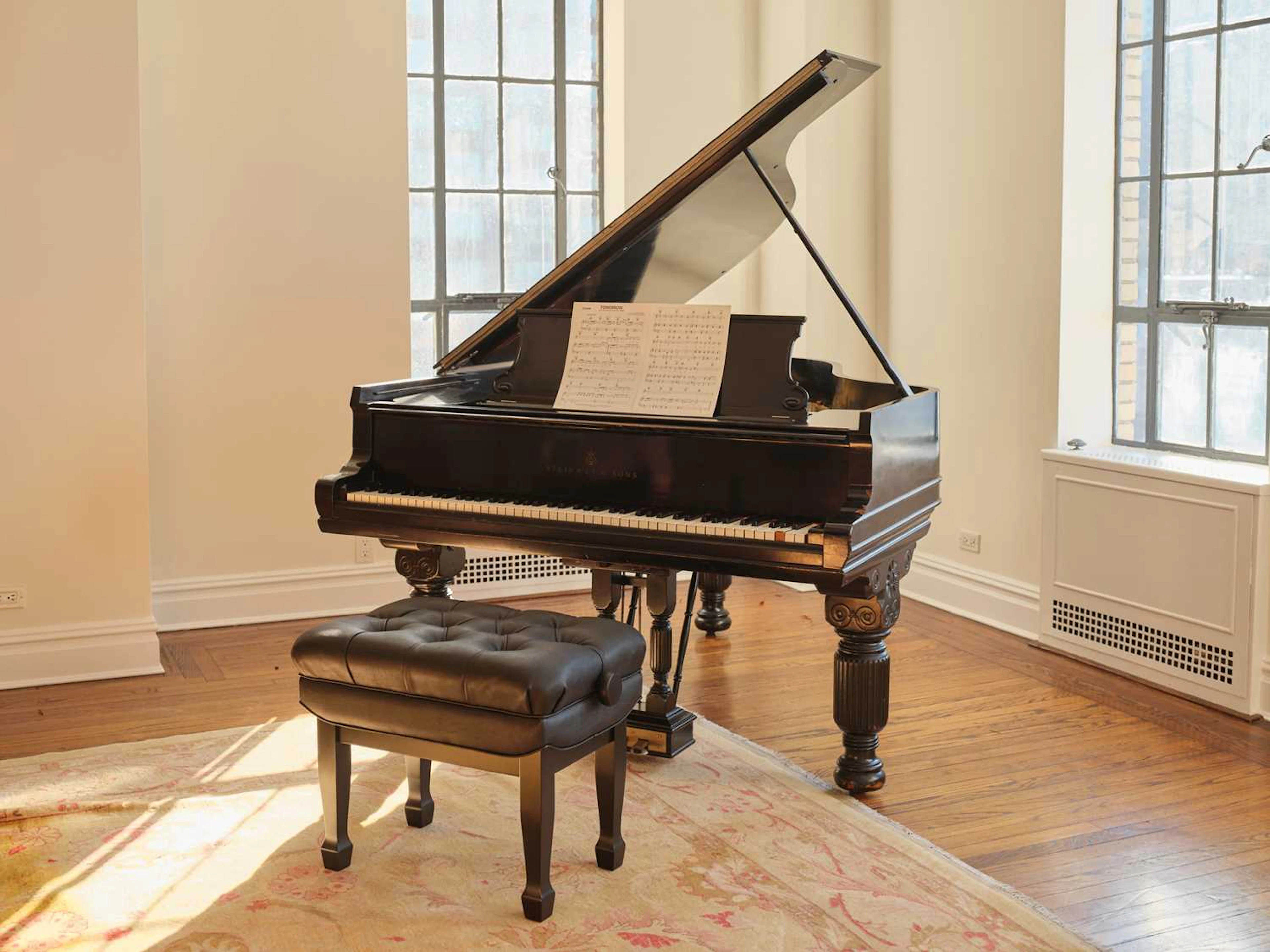 Charles Strouse's antique Steinway used throughout the composition