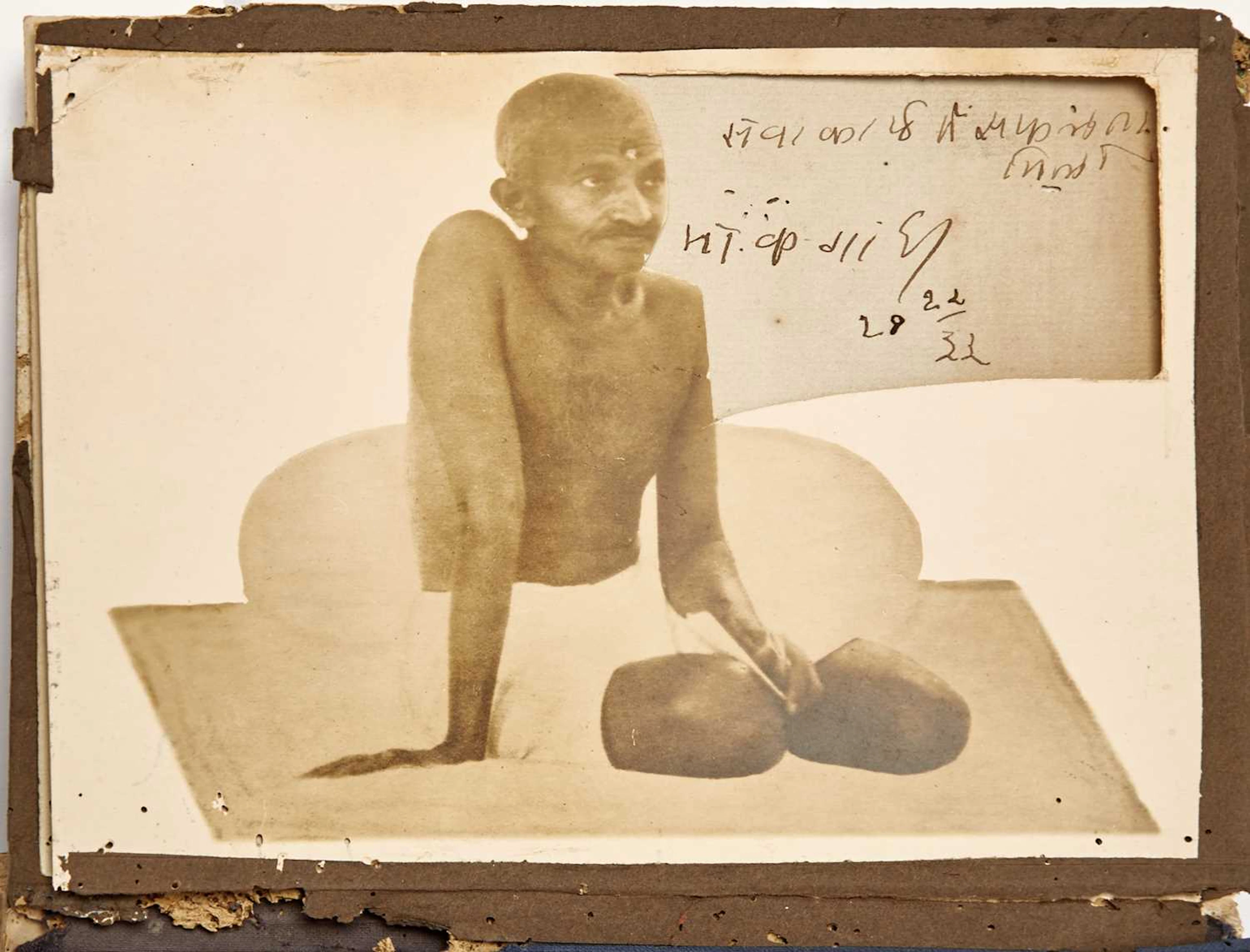 An early photograph of Gandhi with his signature inset