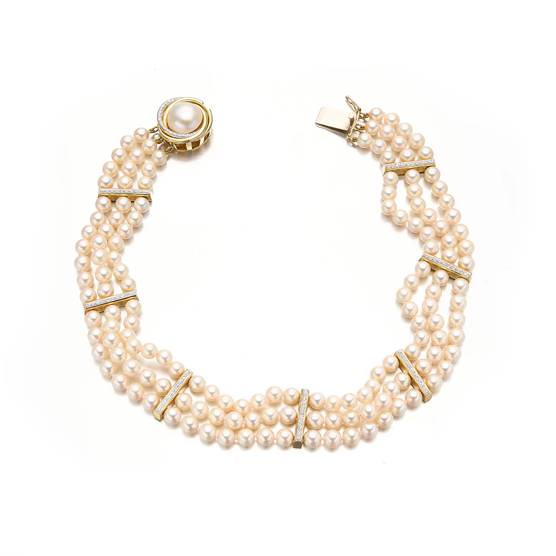 A Cultured Pearl, Diamond and Gold Necklace