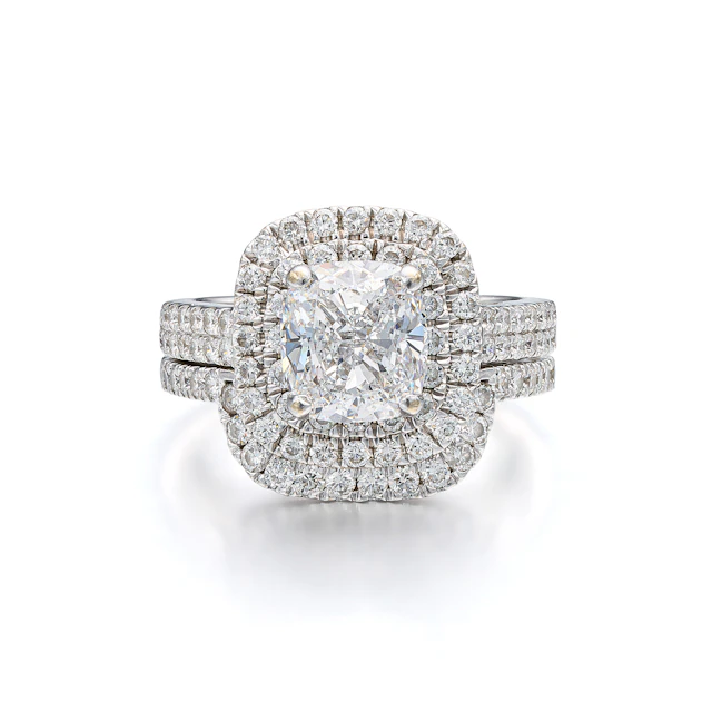 A Canadian Diamond and White Gold Ring and Band