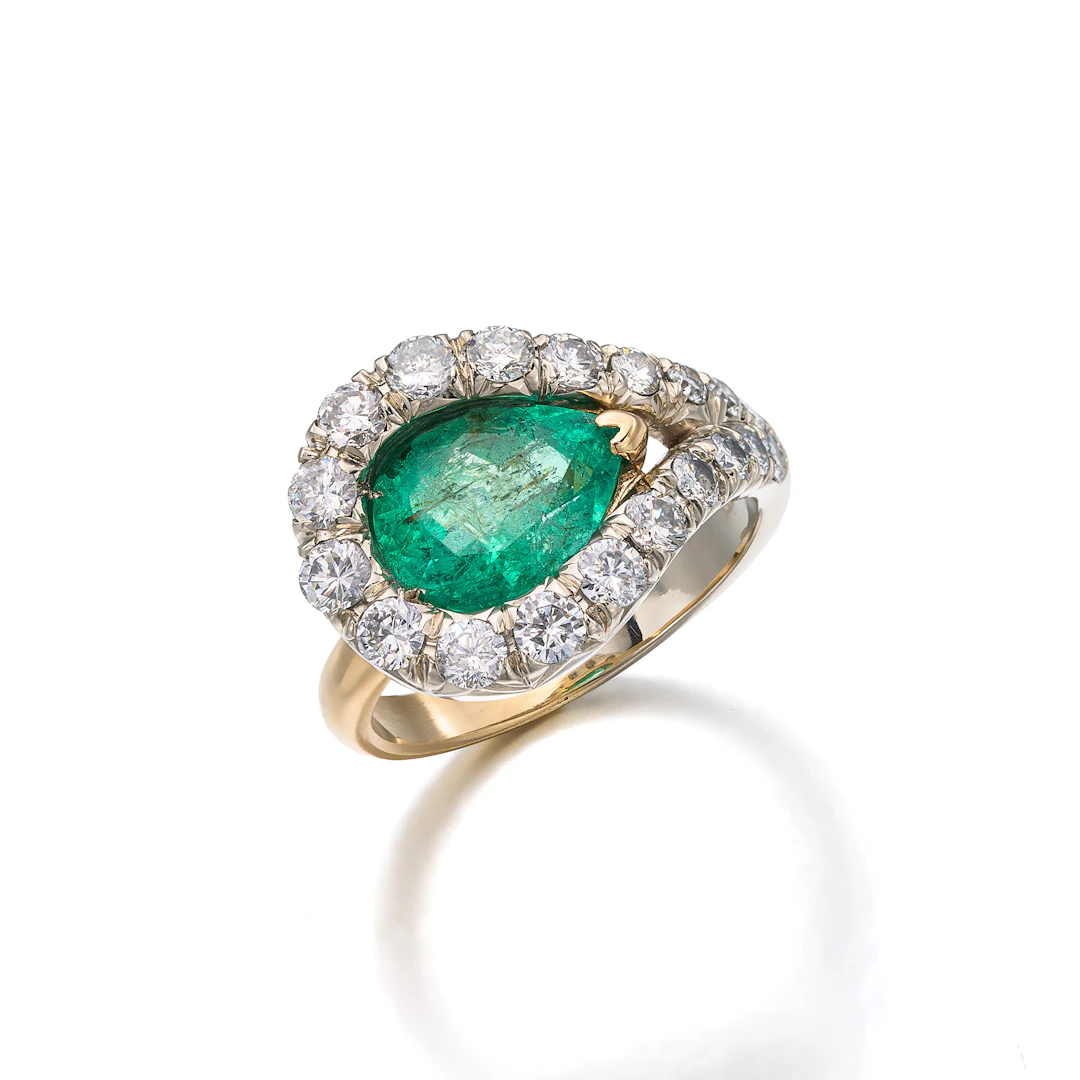 An Emerald, Diamond and Gold Ring