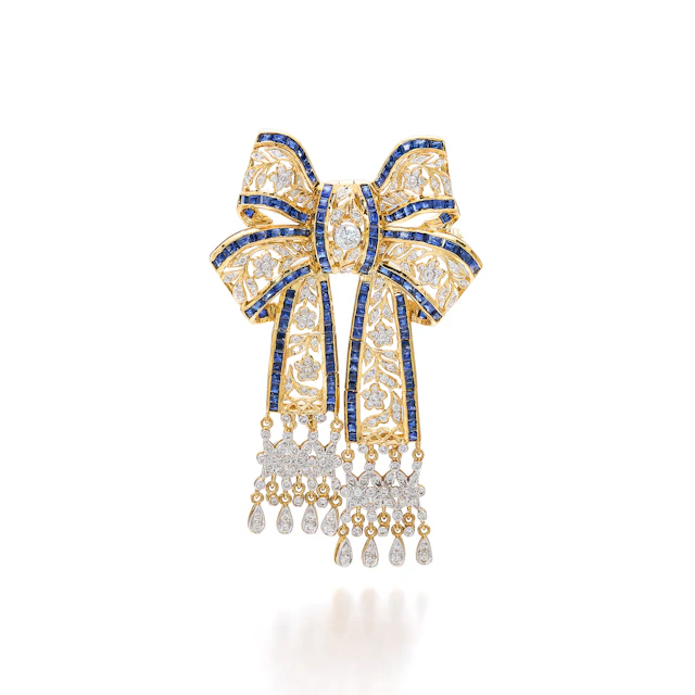 A Sapphire, Diamond and Gold Pendant/Broooch