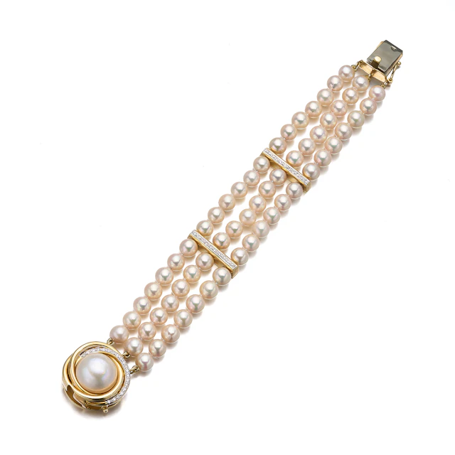 A Cultured Pearl, Diamond and Gold Bracelet