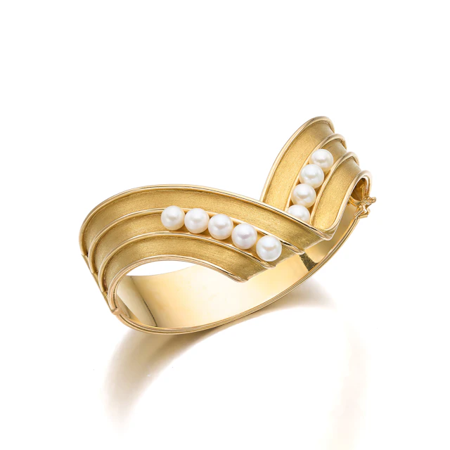 A Cultured Pearl and Gold Bangle Bracelet, by Georges Schwartz