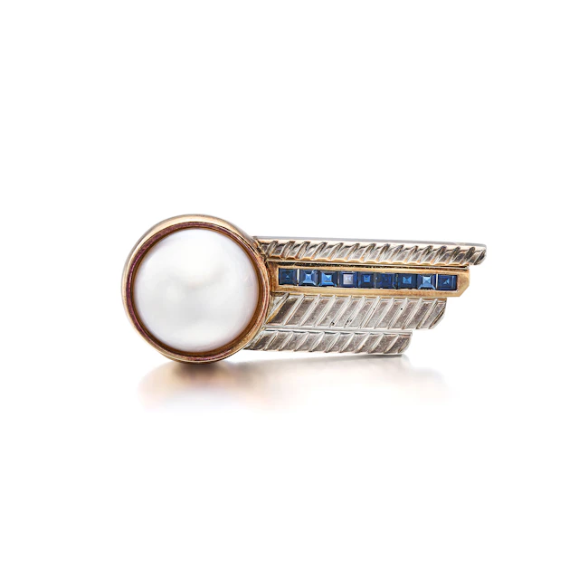 An Art Deco Sapphire, Mabe Pearl, Sterling Silver and Gold Brooch