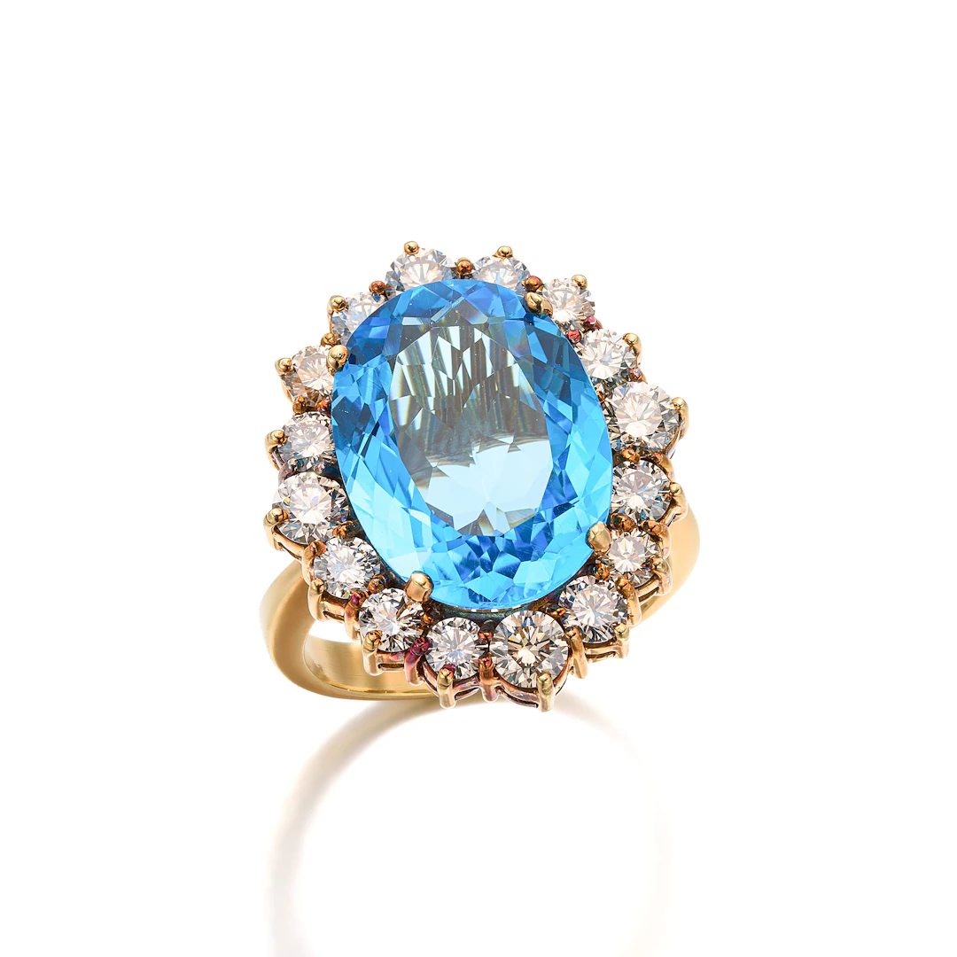 A Blue Topaz, Diamond and Gold Ring