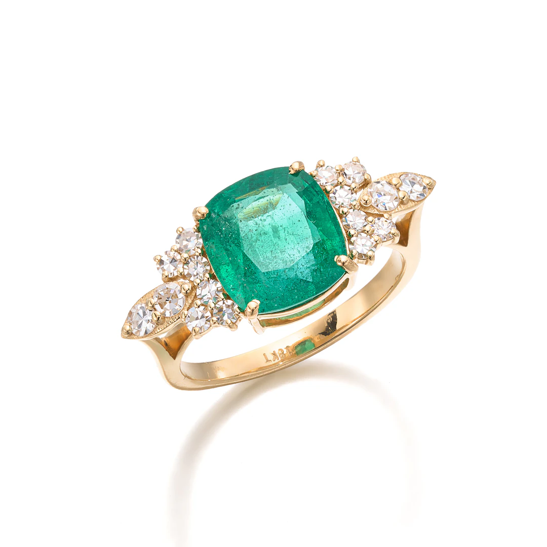 An Emerald, Diamond and Gold Ring