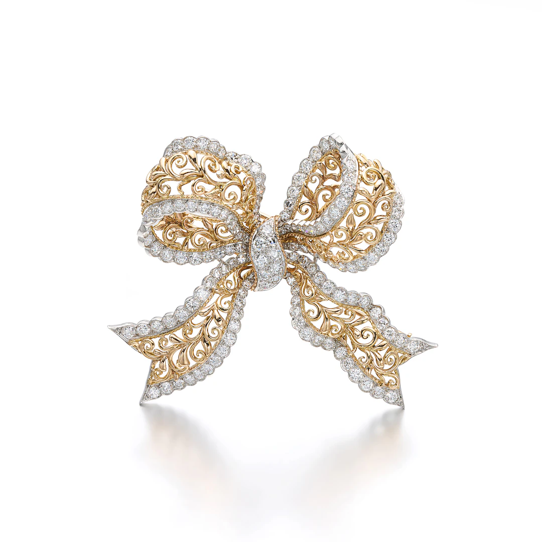 A Diamond, Platinum and Gold Clip Brooch