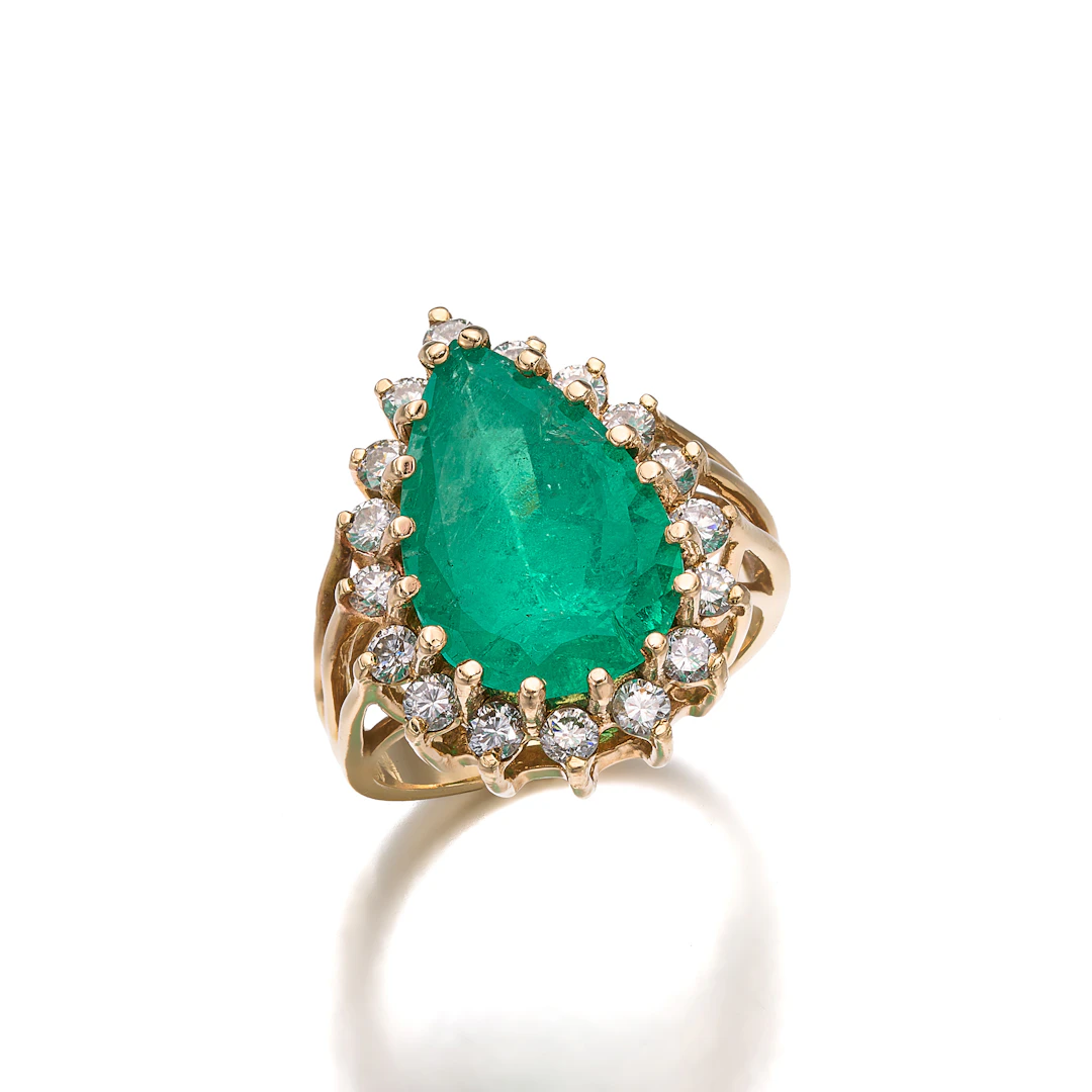 An Emerald, Diamond and Gold Ring