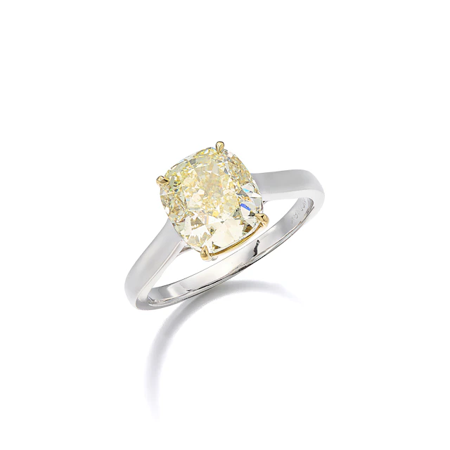 A Coloured Diamond Solitaire and Gold Ring