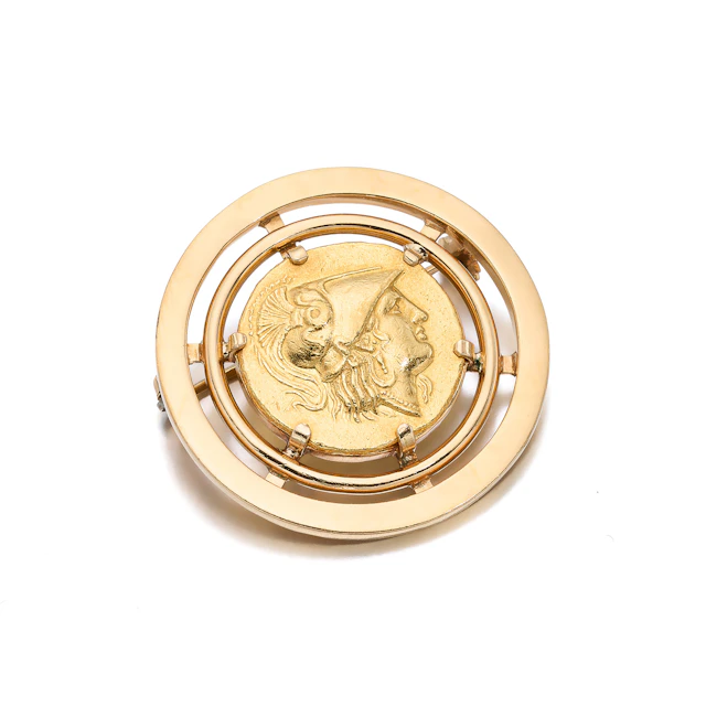 A Gold Coin and Gold Brooch