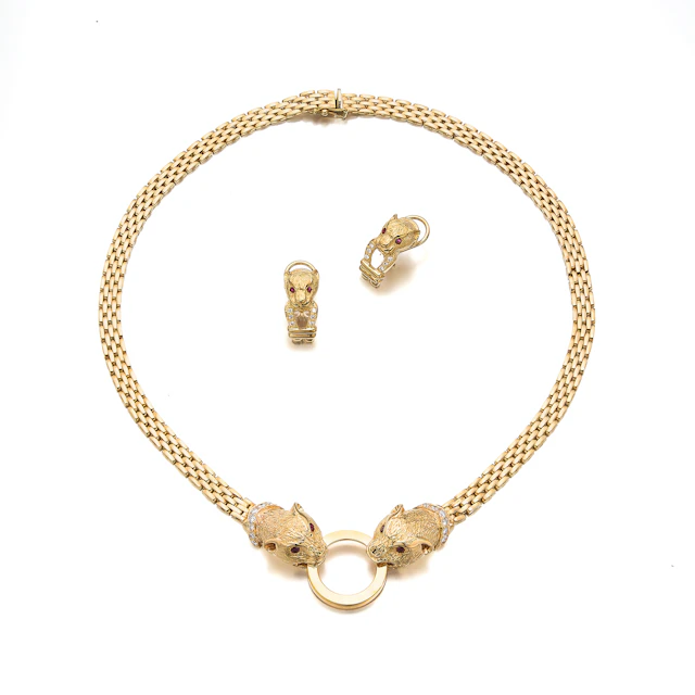 A Diamond, Ruby and Gold Necklace and Ear Clips
