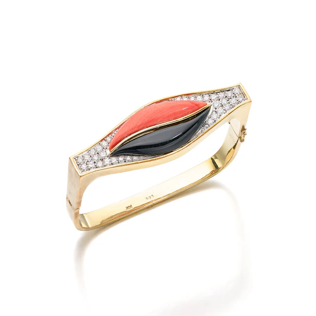 A Coral, Onyx, Diamond and Gold Bangle Bracelet