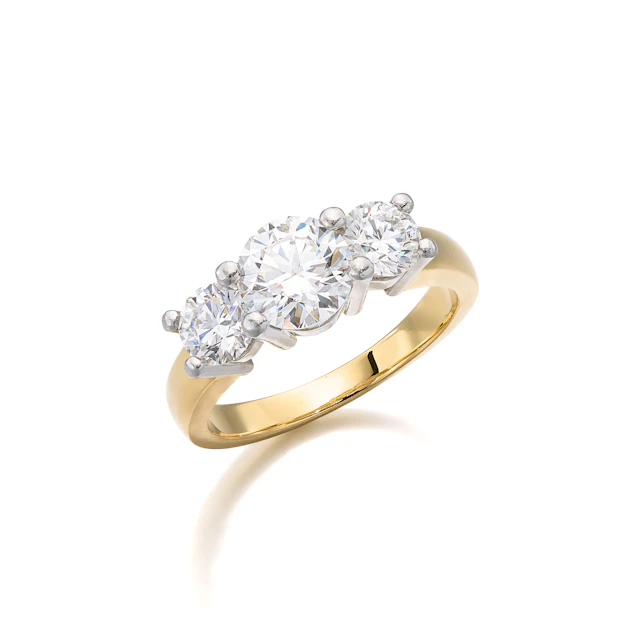 A Three-Stone Diamond, Platinum and Gold Ring, Birks