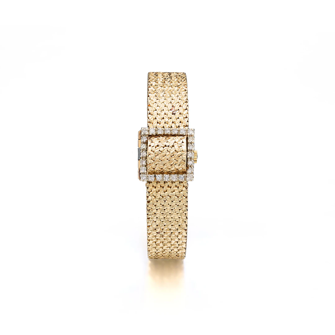 A Lady's Diamond and Gold Bracelet Watch