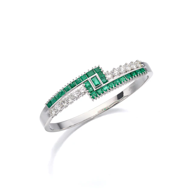 An Emerald, Diamond and White Gold Bangle Bracelet