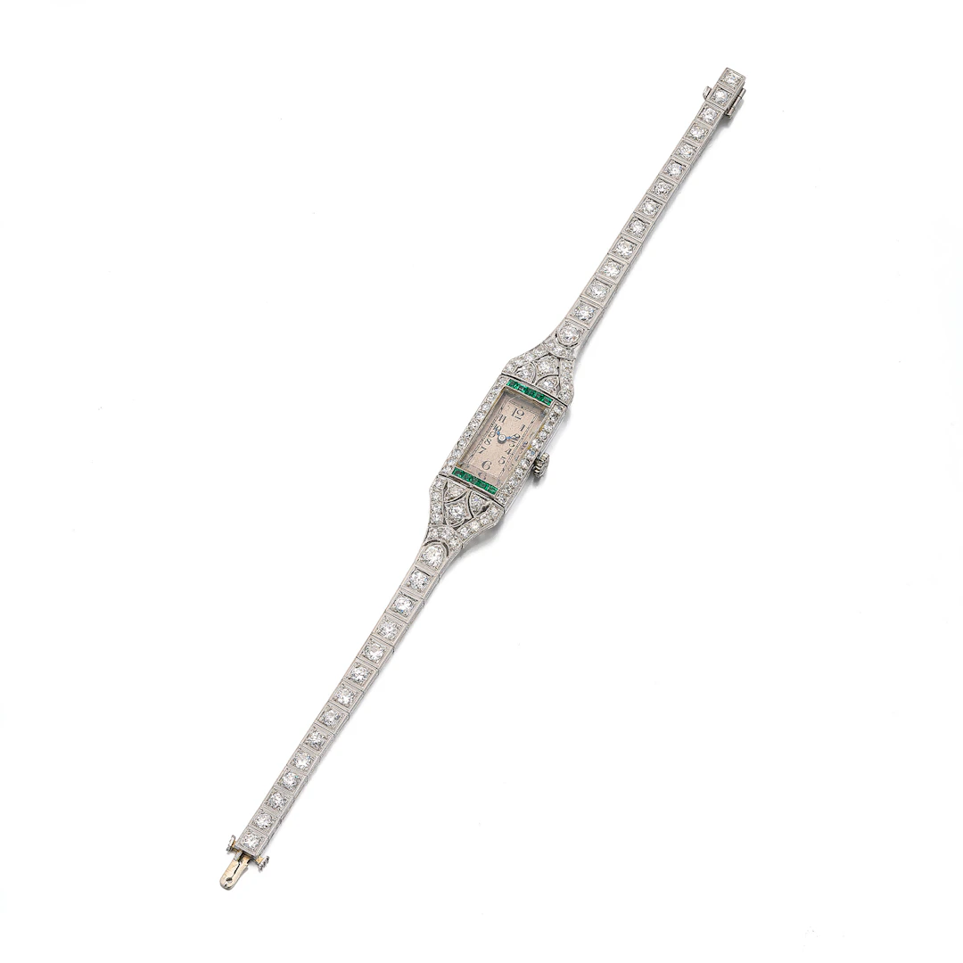 A Lady's Art Deco Emerald, Diamond and Platinum Wristwatch
