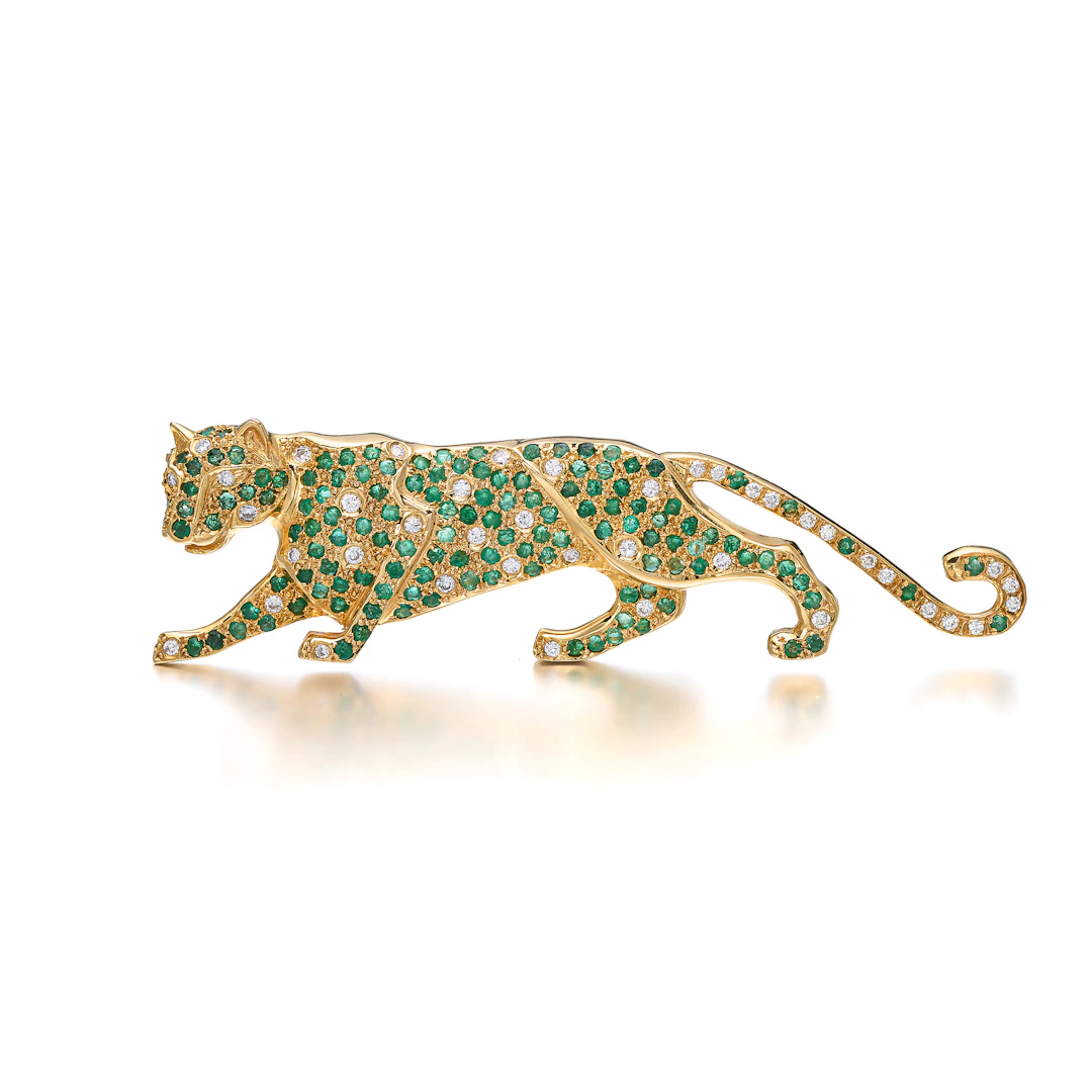 An Emerald, Diamond and Gold Brooch