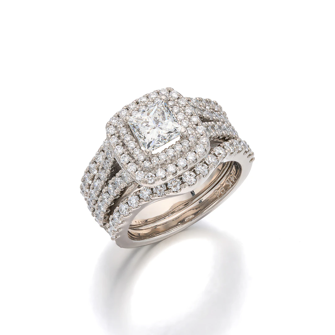 A Diamond and White Gold Ring and Two Fitted Bands