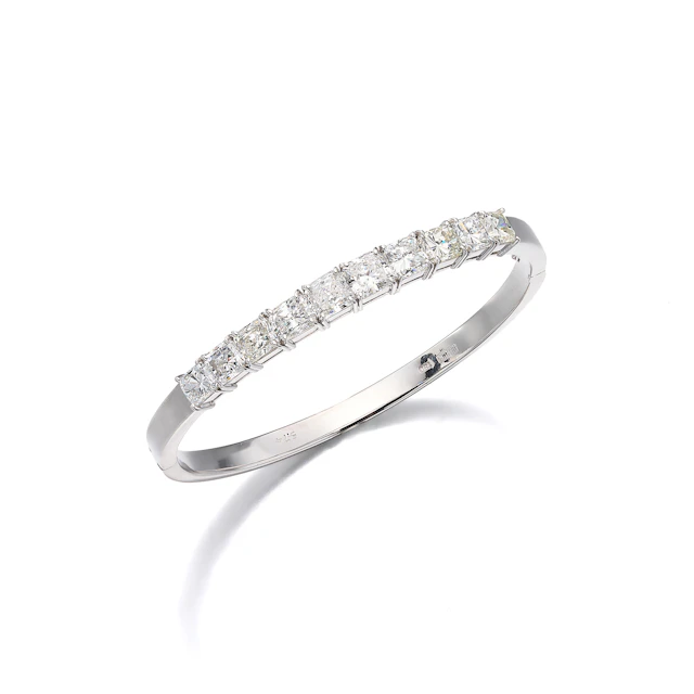 A Diamond and White Gold Bangle Bracelet