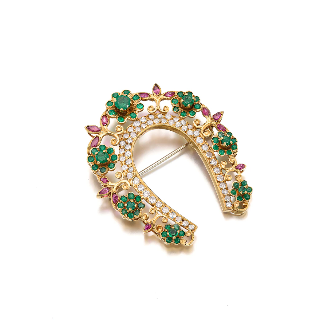 An Emerald, Ruby, Diamond and Gold Brooch