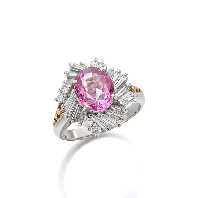 A Pink Sapphire, Diamond, Platinum and Gold Ring