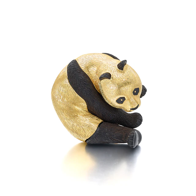 An Onyx and Gold Clip Brooch, by Gallopin