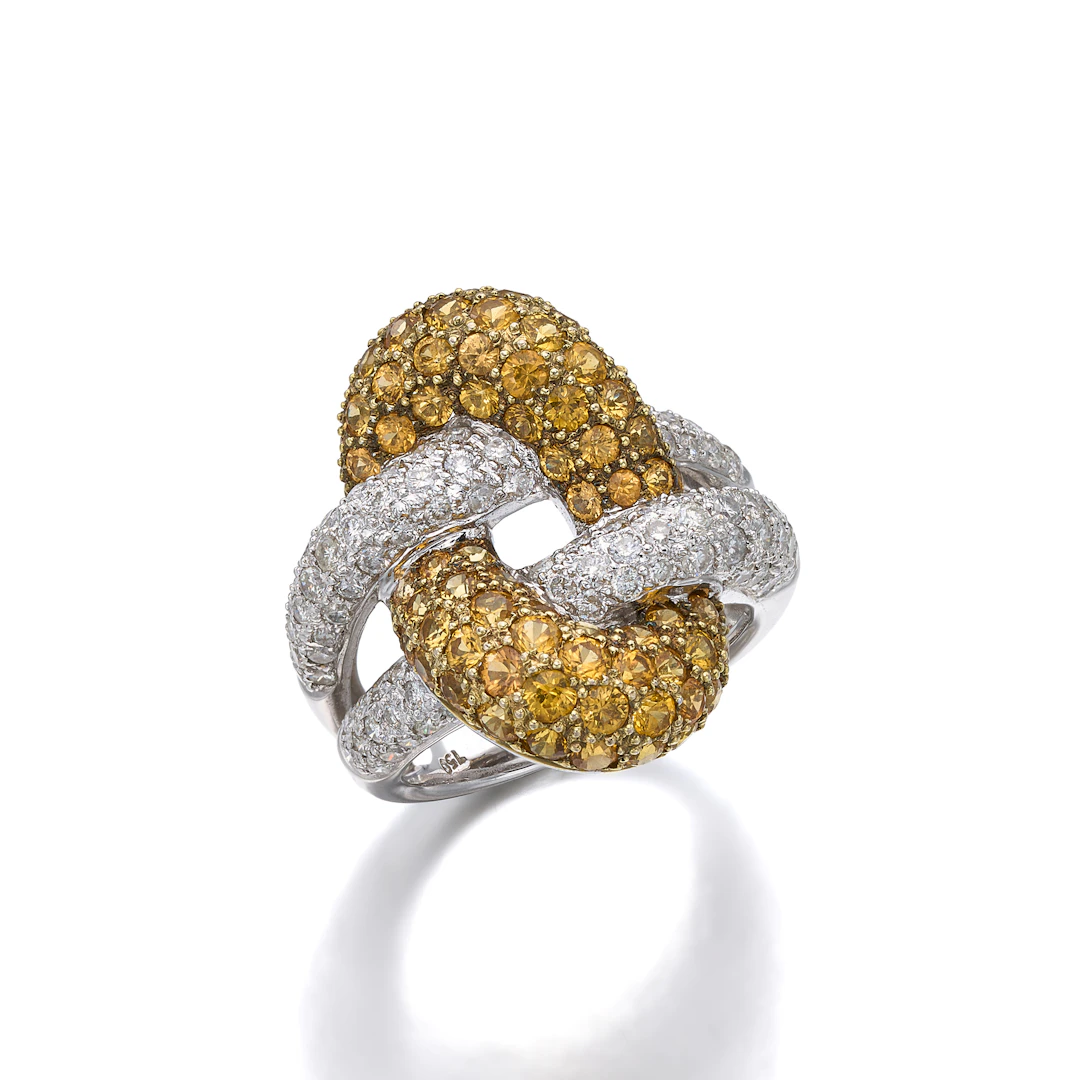 A Yellow Sapphire, Diamond and White Gold Ring