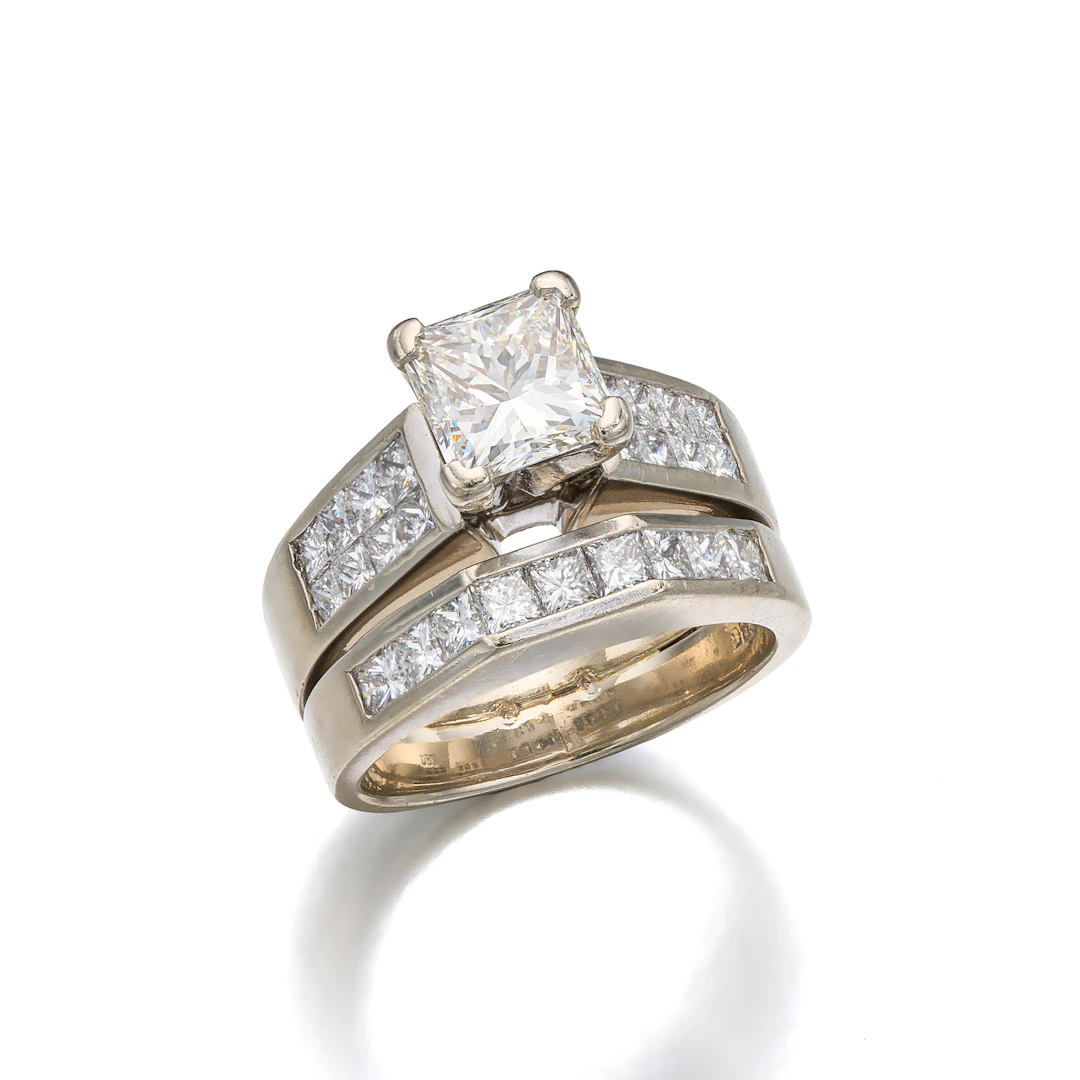 A Diamond and White Gold Ring with Attached Band