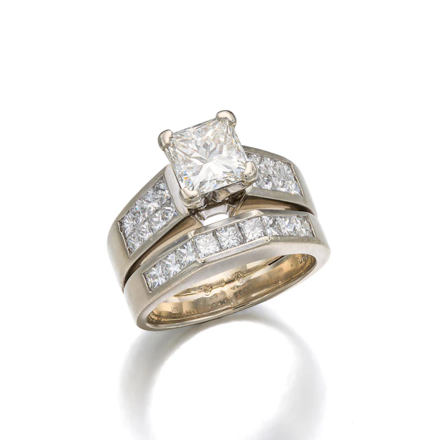 A Diamond and White Gold Ring with Attached Band