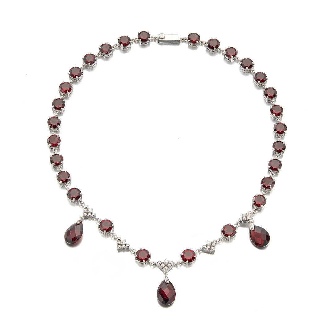 A Garnet, Diamond and White Gold Necklace