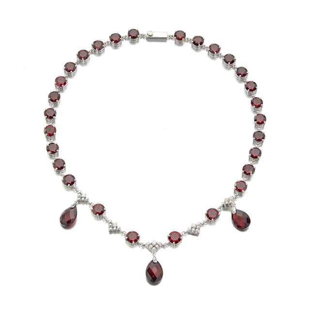 A Garnet, Diamond and White Gold Necklace