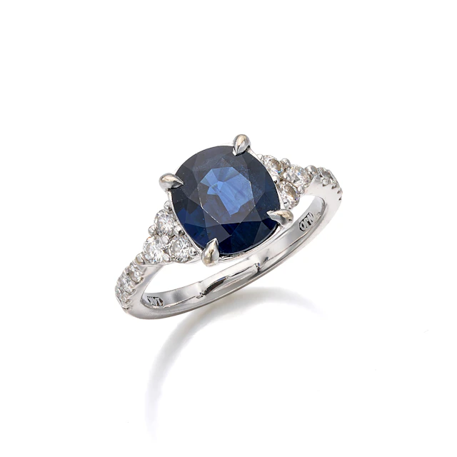 A Sapphire, Diamond and White Gold Ring