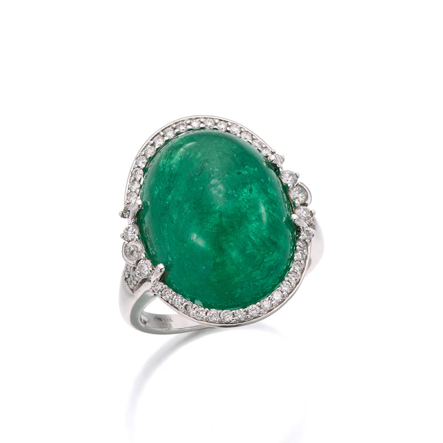 An Emerald, Diamond and White Gold Ring