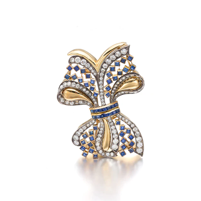 A Sapphire, Diamond, Silver and Gold Brooch