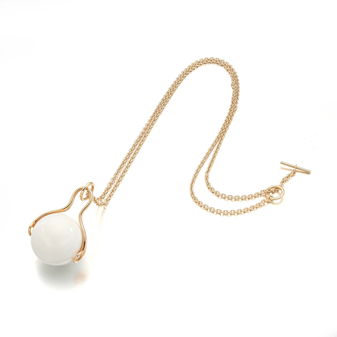 A White Chalcedony and Gold Pendant Necklace
