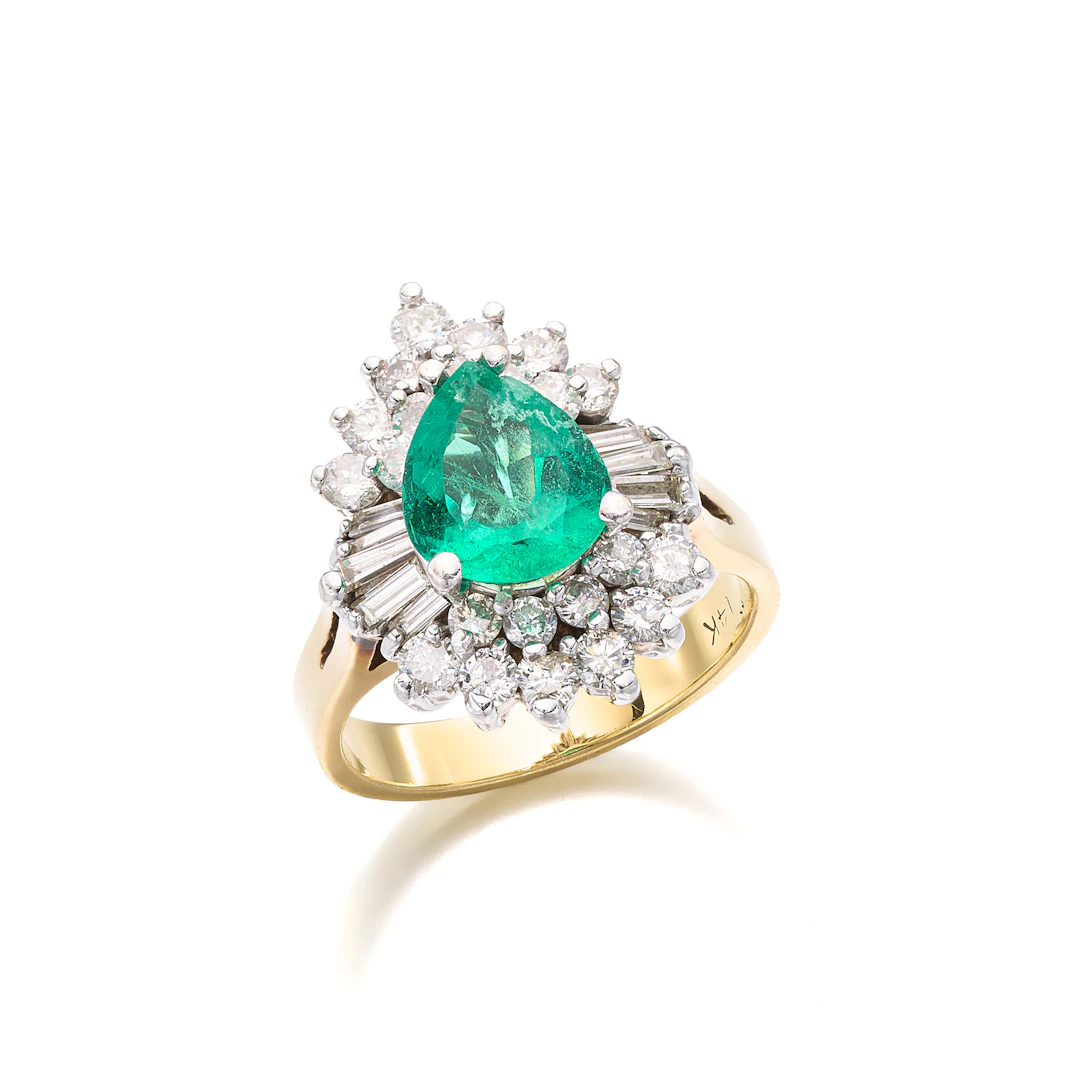 An Emerald, Diamond and Gold Ring