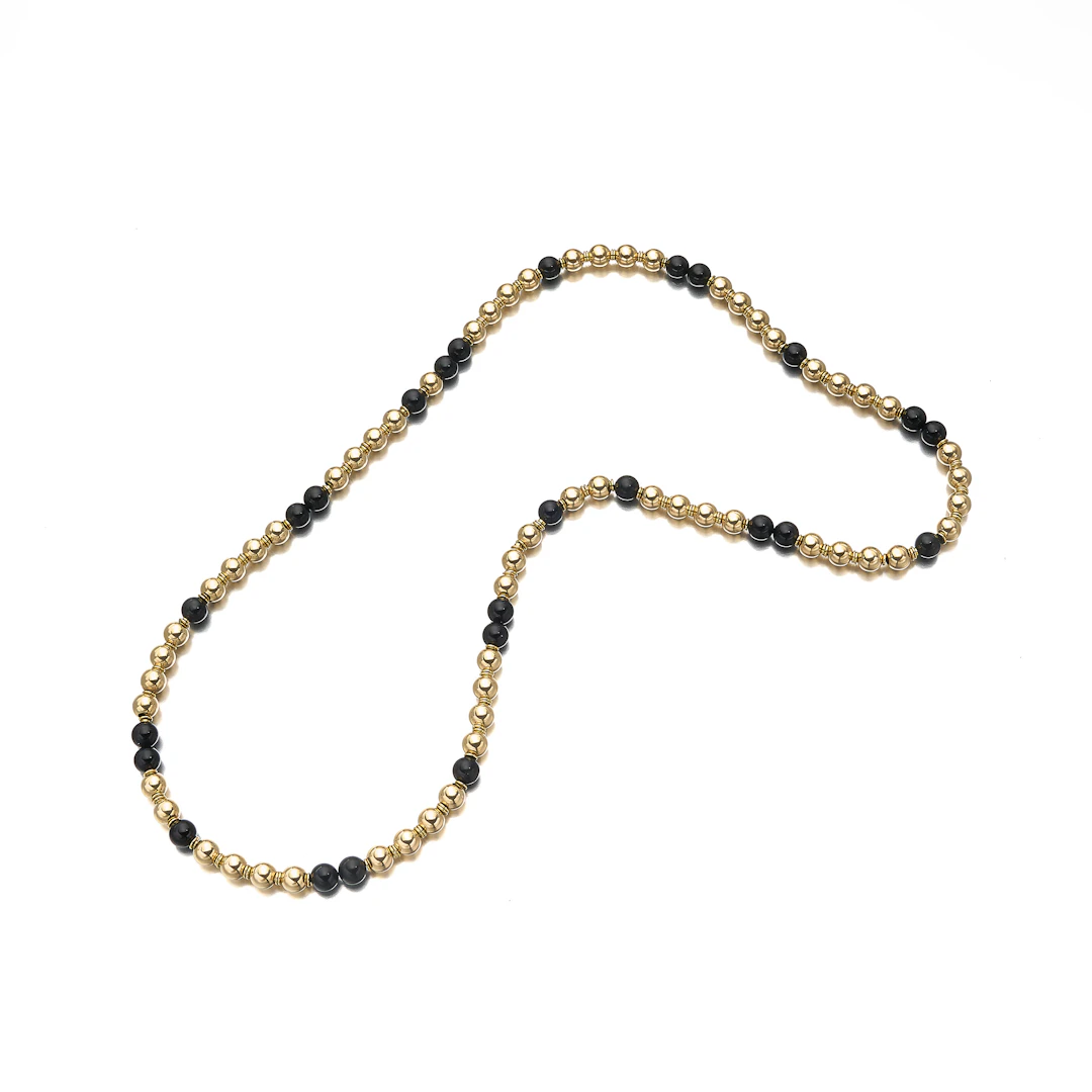 An Onyx and Gold Bead Necklace