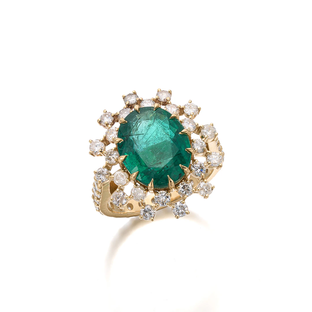 An Emerald, Diamond and Gold Ring