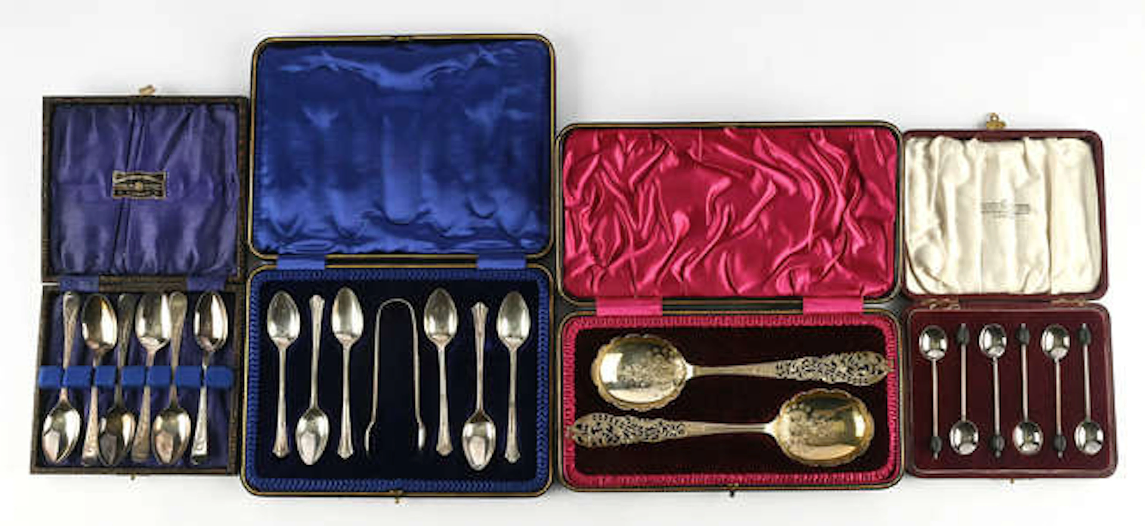 Cased pair of serving spoons with pierced foliate handles. by C W
