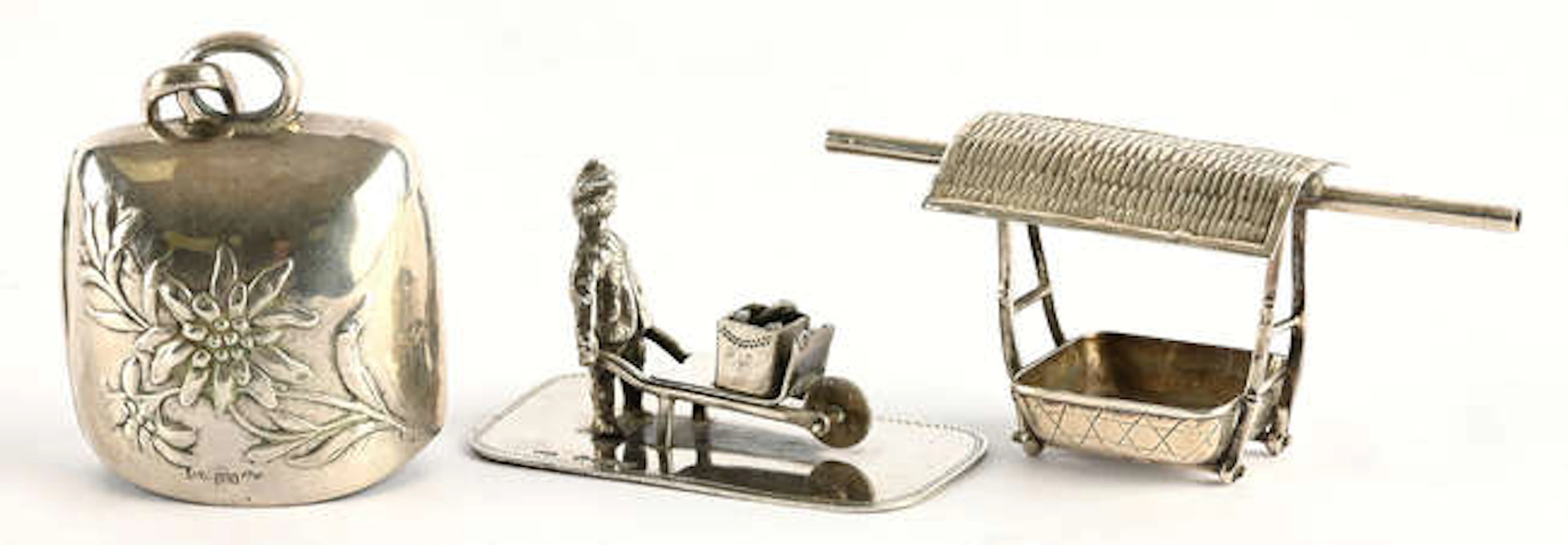 Miniature figure of a log vendor pushing a barrow, import marks for