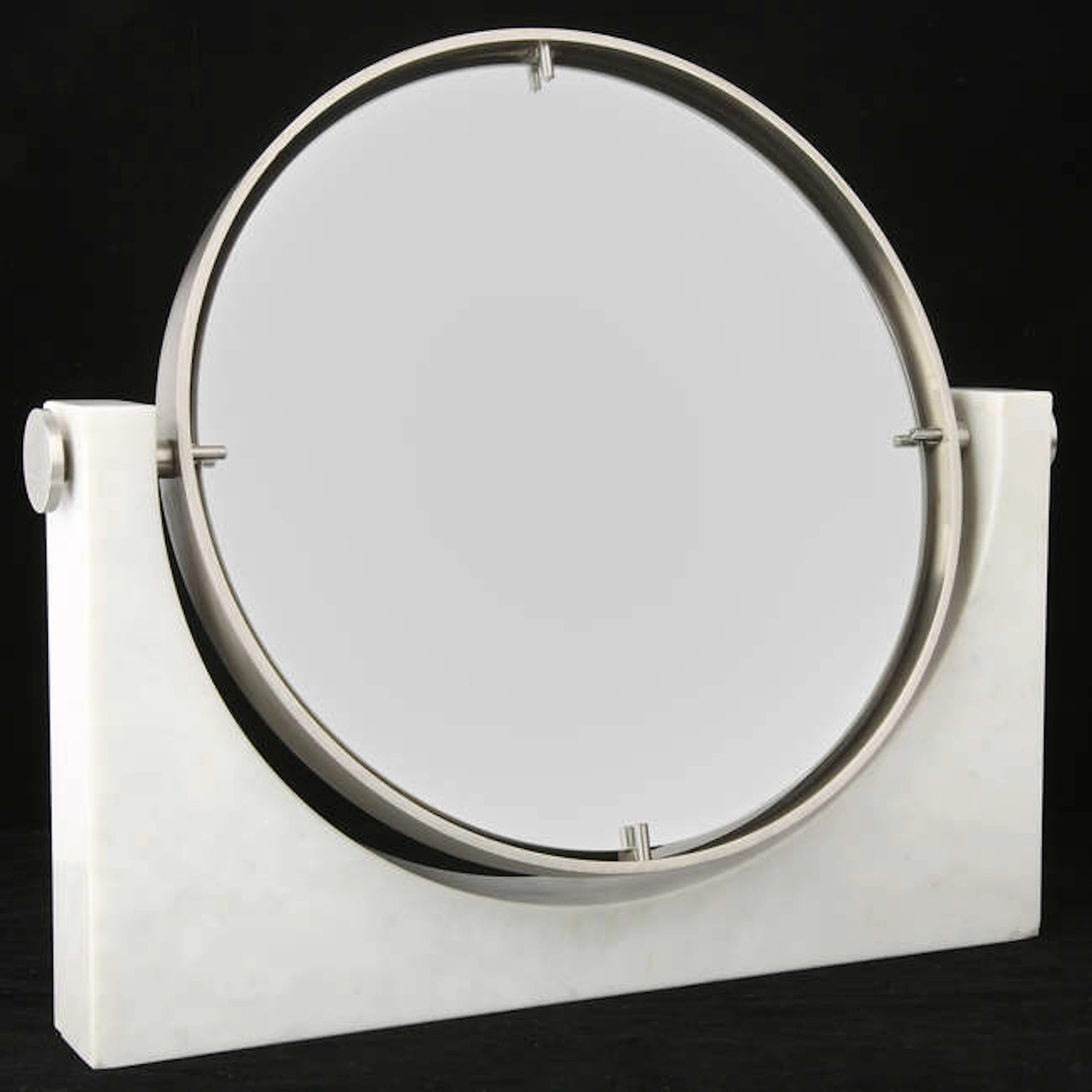 ATTRIBUTED TO ANGELO MANGIAROTTI, a circular mirror, on Carrara marble