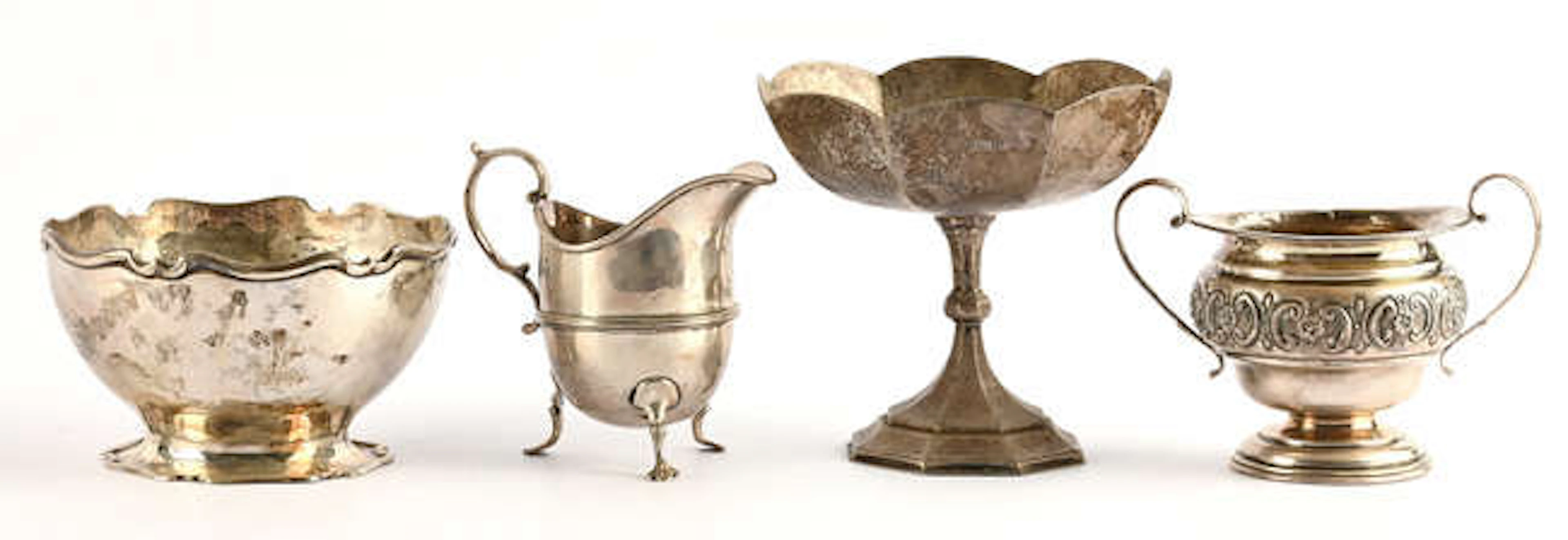 Helmet shaped cream jug wit scroll handle by Mappin & Webb, London