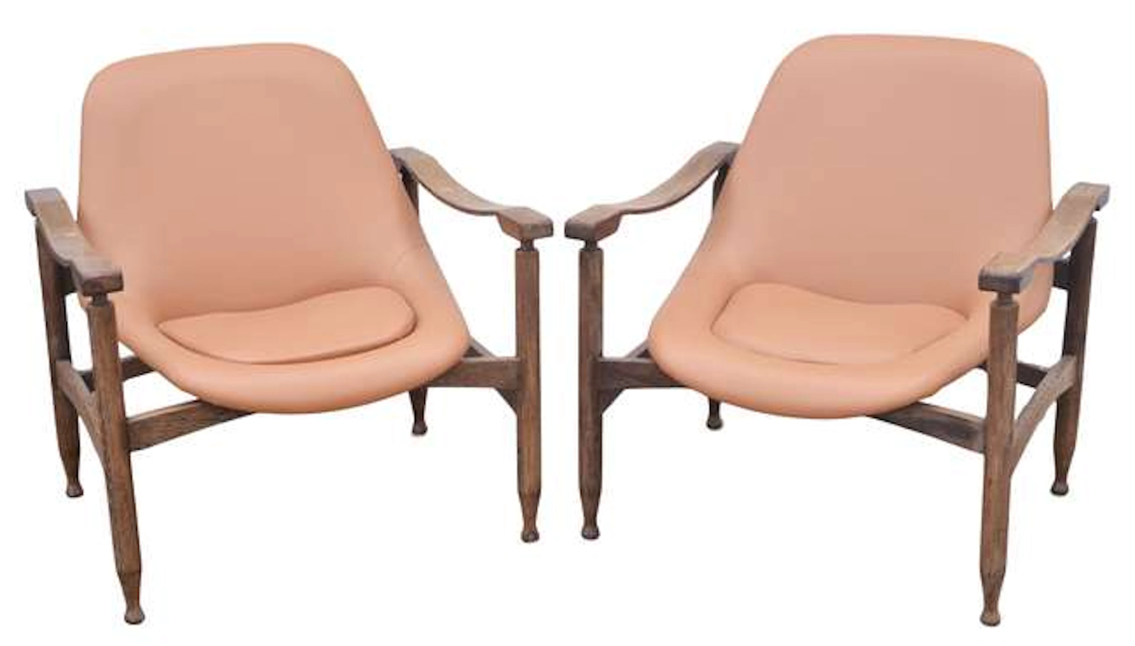 BUSNELLI, a pair of 'Tiki' armchairs, palm wood and leather, recently
