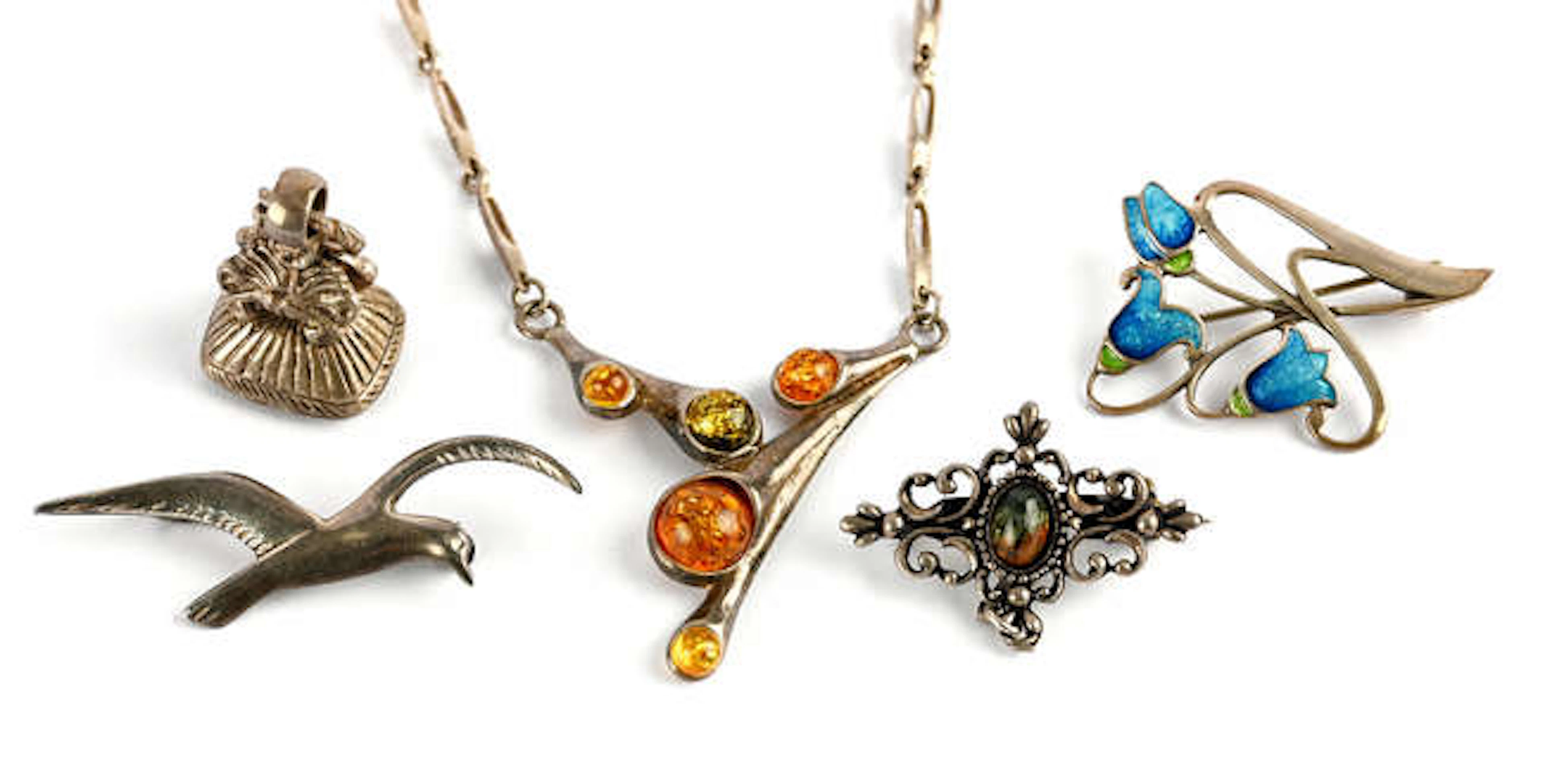 A group of silver items, including a silver and enamel bluebell brooch