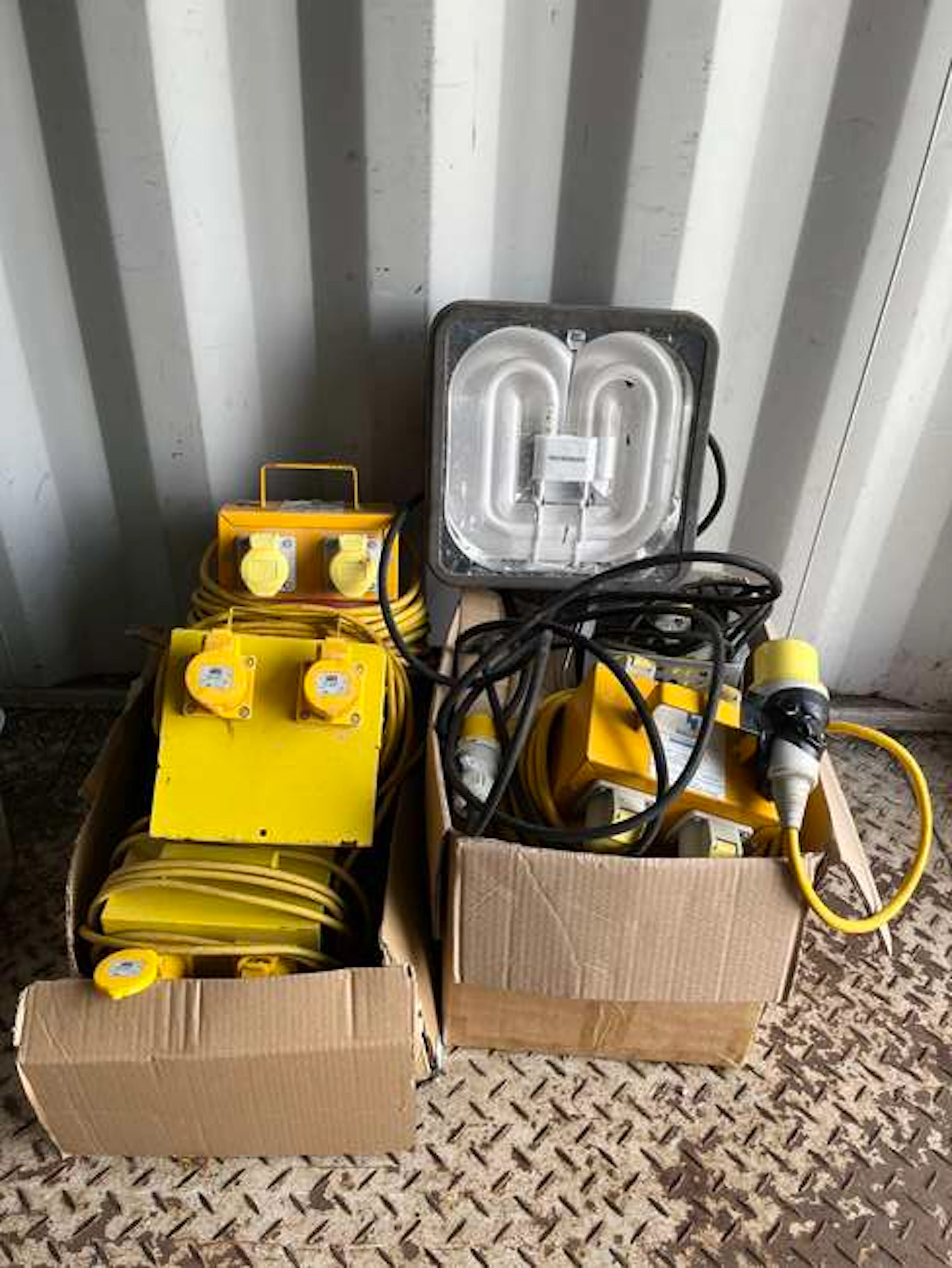 Selection of 110v Junction boxes and 110v extension leads and spot light.