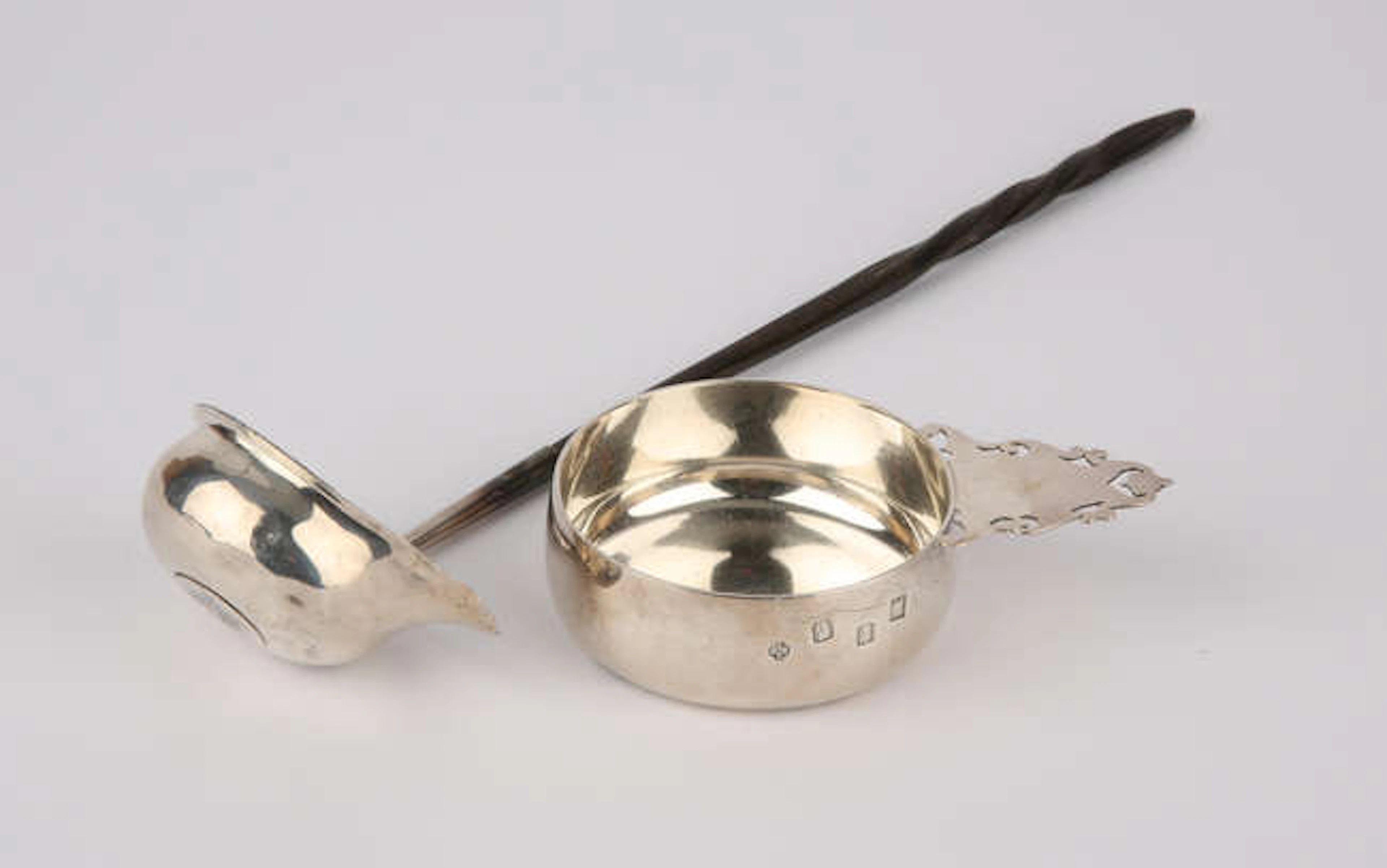 An Irish silver tastevin with pierced handle, by Royal Irish Silver