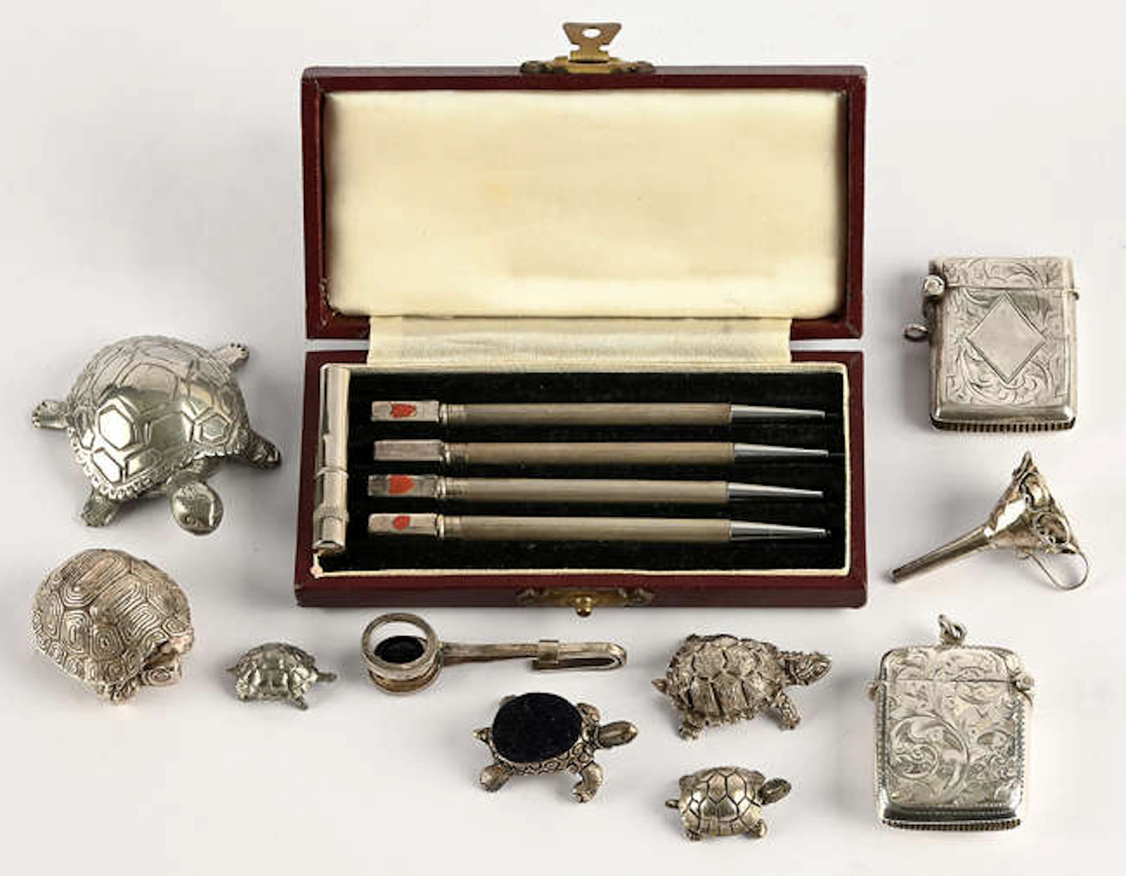 Small silver novelties to include, miniature tortoise pin cushion