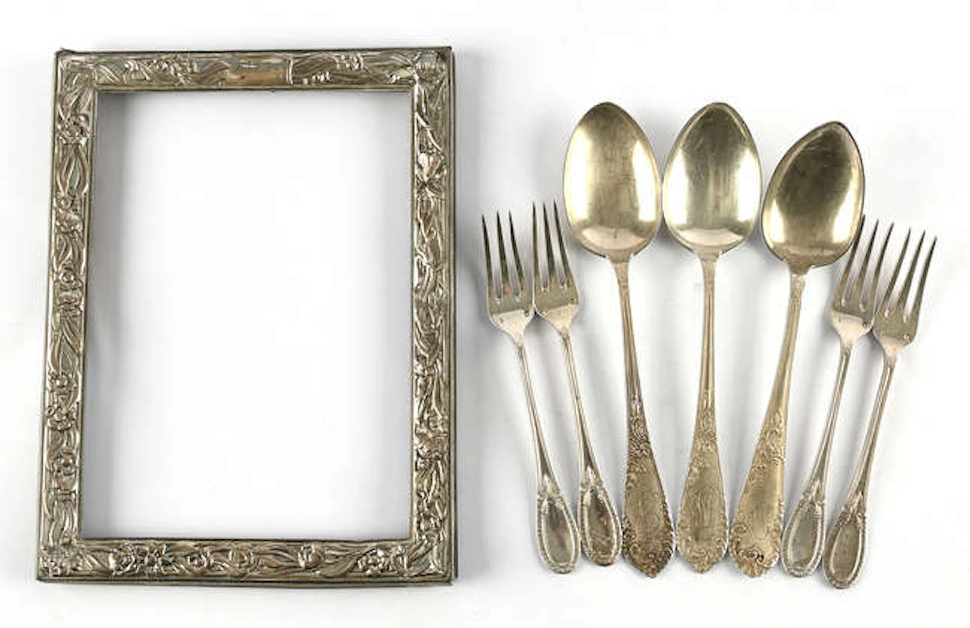 Mixed lot of continental silver flatware and a photograph frame, weighable